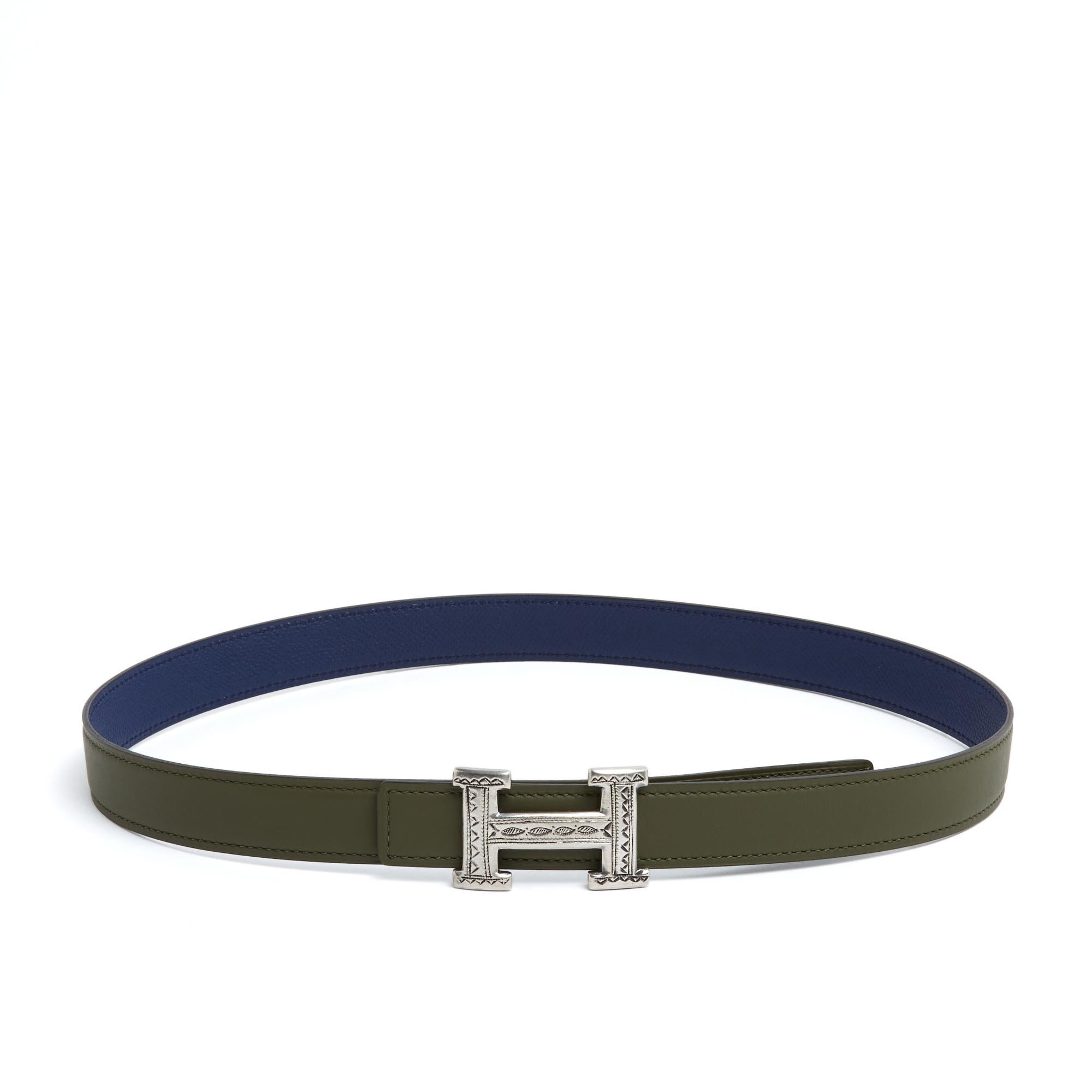 Hermès belt series A composed of a reversible leather strap in smooth Swift leather Veronese green and Epsom grained leather Sapphire Blue almost navy, dated 2025, and a H or Constance buckle in solid silver decorated with Tuareg motifs, handmade,