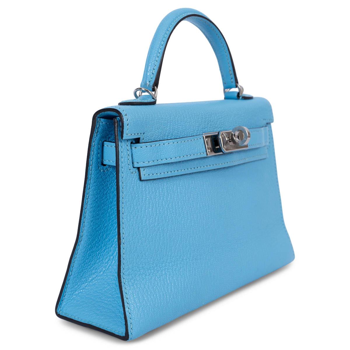 100% authentic Hermès Kelly 20 Sellier Bag in Celeste blue chèvre Mysore leather featuring Palladium hardware. Lined in chèvre leather with one patch pocket against the back. Has been carried and is in excellent condition. Comes with shoulder strap,