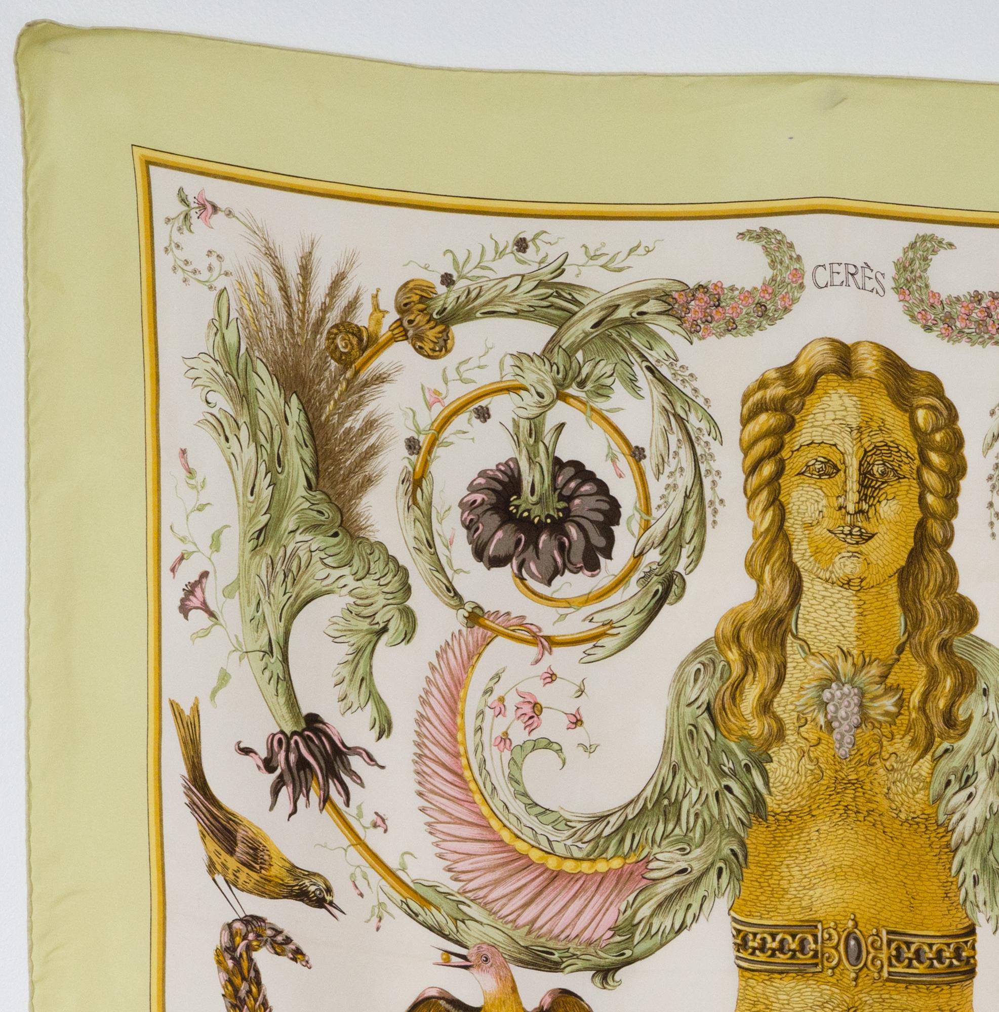 Hermes silk scarf Ceres by Françoise Faconnet featuring a light green border. 
First edition in 1967
In good vintage condition. Made in France.
35,4in. (90cm)  X 35,4in. (90cm)
We guarantee you will receive this  iconic item as described and showed