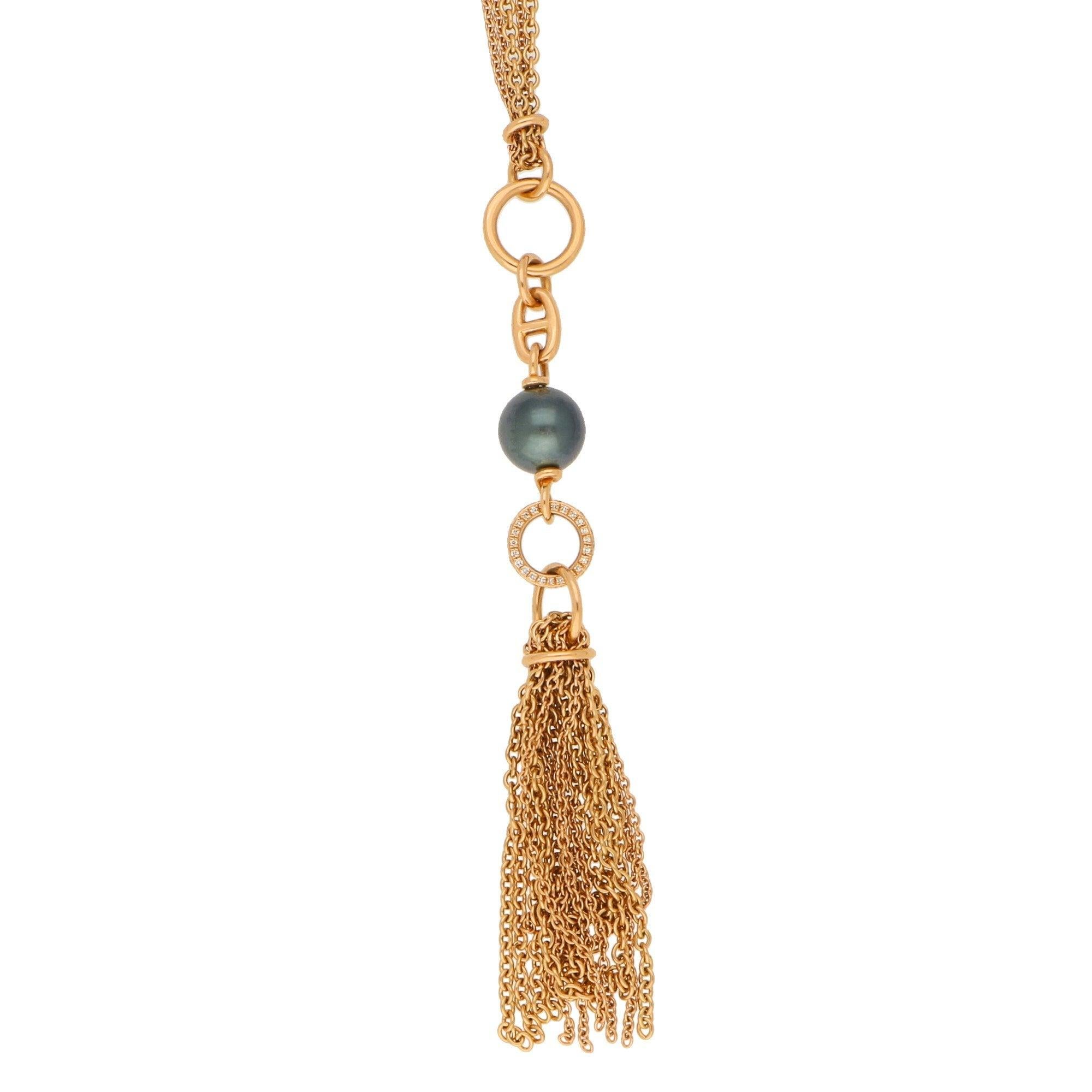 Pearl approximately 9.5mm. Diamonds approximately 0.19 carats in total. 
A vintage Hermes Chain d'Ancre black pearl and diamond tassel sautoir necklace in 18-karat rose gold. 
The necklace's centre piece features a dark grey pearl below a classic