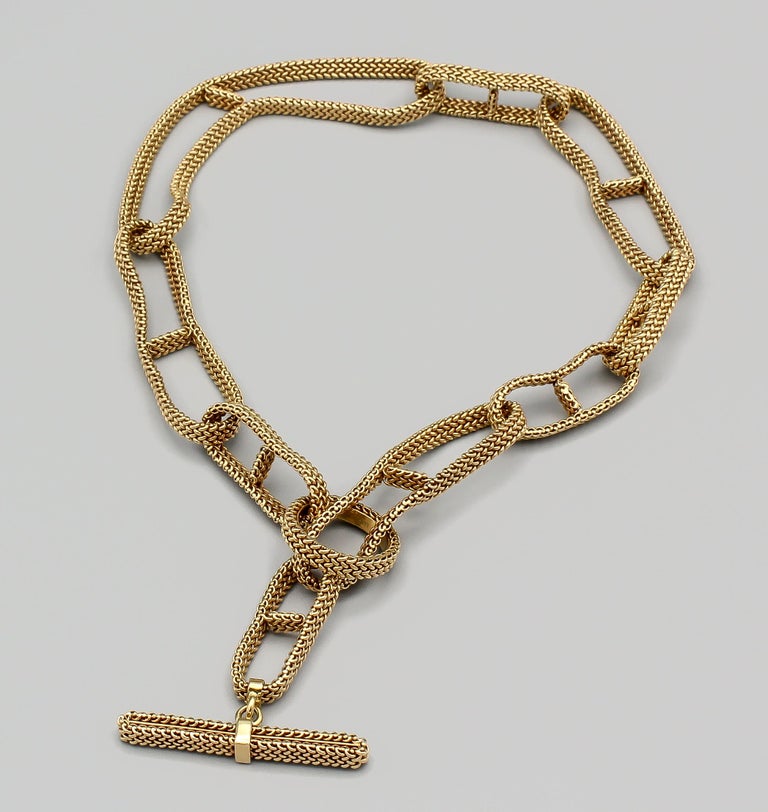 Rare and fine 18K yellow gold flexible mesh necklace  by Hermes. It features links of a flexible nature, in varying sizes, with a toggle and loop closure.  Made for a limited time in very limited quantities.

Hallmarks: Hermes, AU750, reference