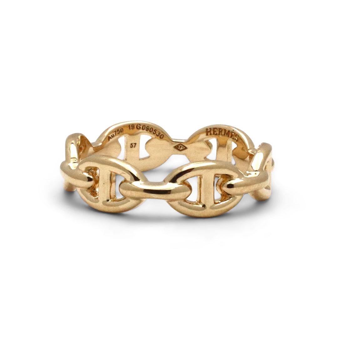 Authentic Hermès 'Chaine d'Ancre Enchainee' ring crafted in 18 karat yellow gold. This classic ring features a chain link design inspired by ship anchor chains. Signed Hermes, AU750, Made in France, with serial number and hallmarks. Ring size 57 (US