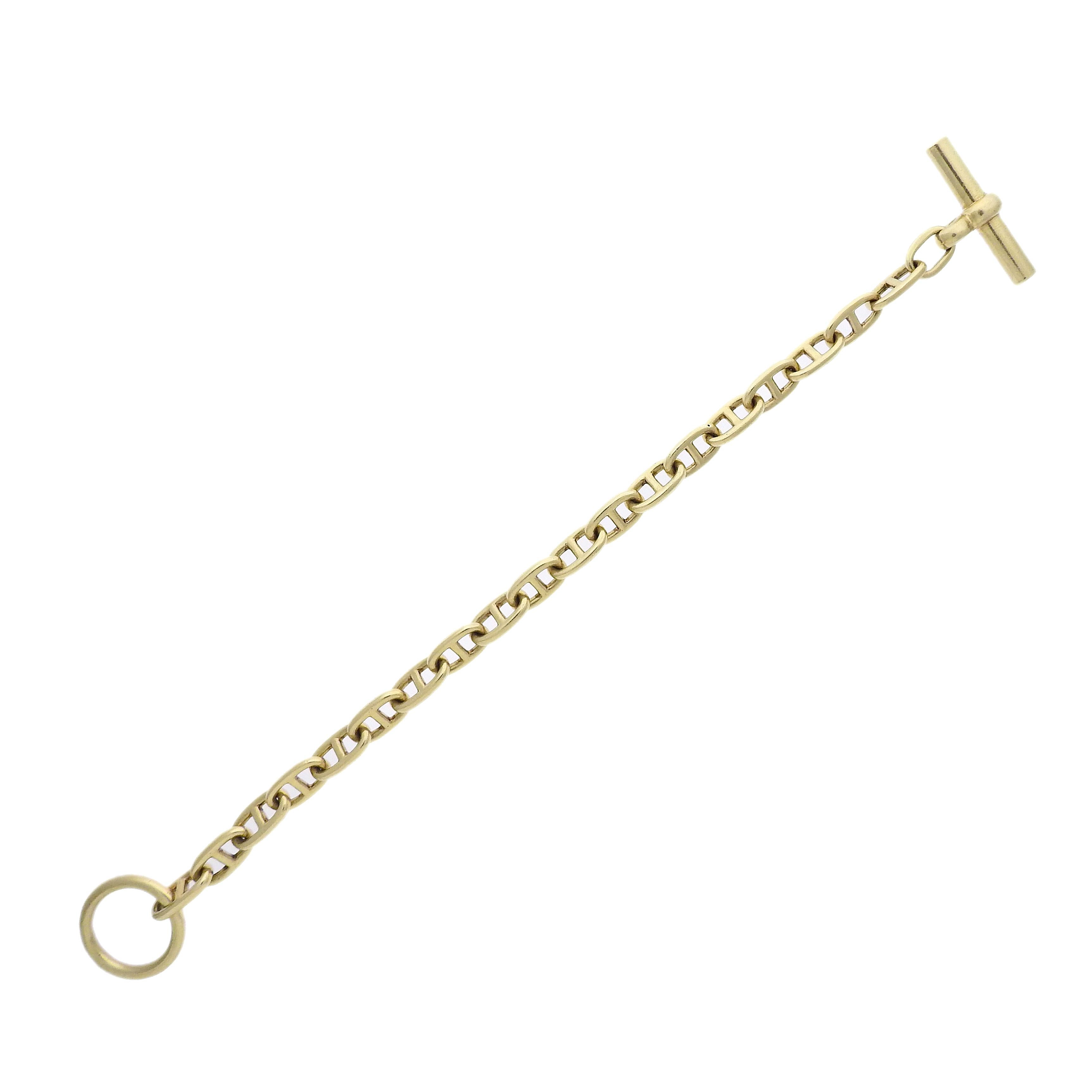 18k yellow gold bracelet crafted by Hermes for the Chain D'Ancre collection. Bracelet measures 7 3/4
