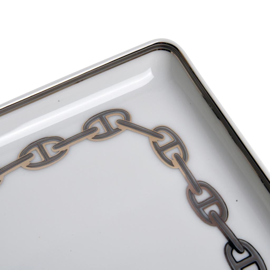 Guaranteed authentic Hermes Chaine D'Ancre Platinum porcelain tray
Pays tribute to the iconic bracelet created in 1938.
A perfect accent piece for any room.
Wonderful for desk or gifting.
Comes with signature Hermes box and ribbon.
New or Store