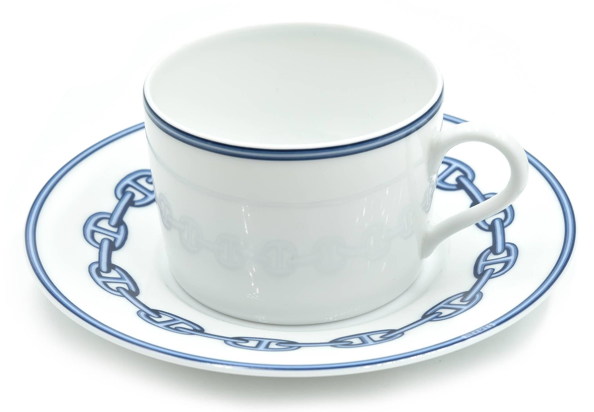 Designer: Hermes
Collection: Chaine D’Ancre
Material: porcelain
Set: two cups and two plates included
Dimensions of Cups: 3 inches in diameter and 2 inches tall
Dimensions of Plates: 5 ¾ inches in diameter and 1 inch tall 
