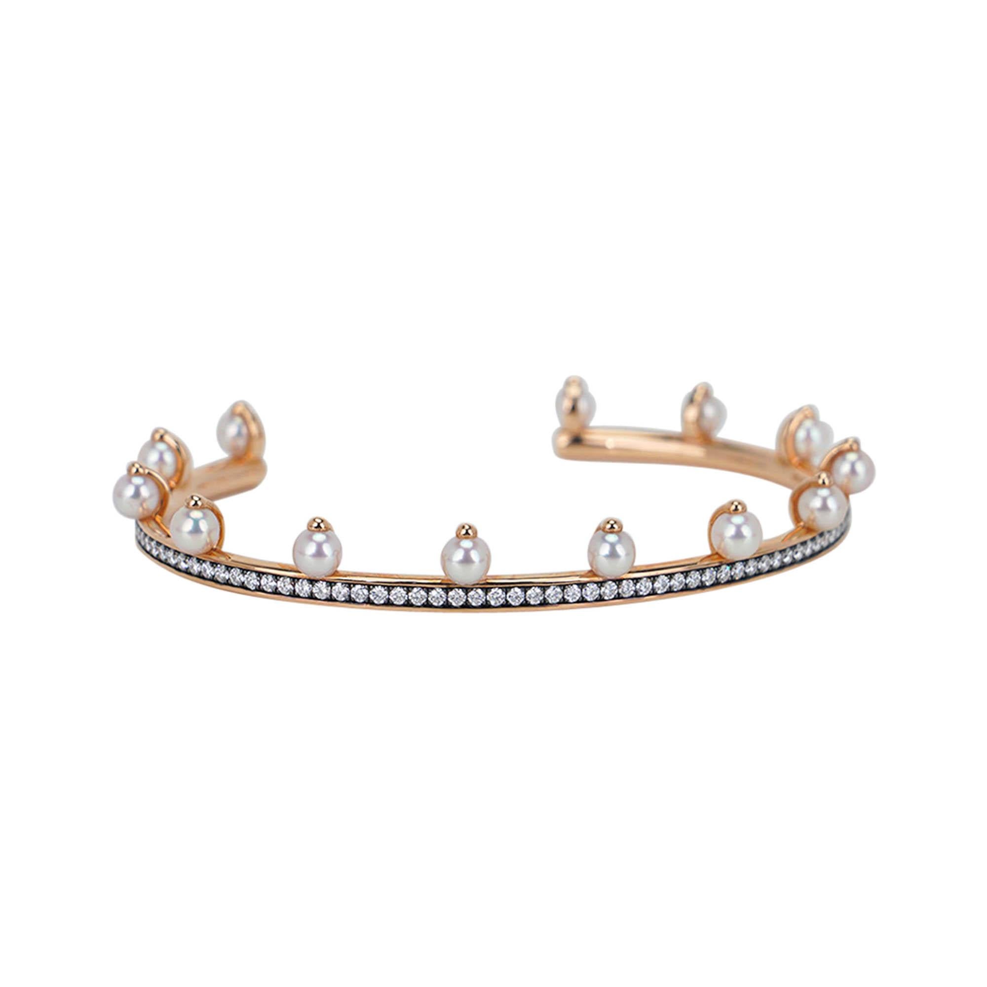 Mightychic offers a limited edition Hermes Chandra Jonc bracelet.
This exquisite bracelet/cuff is featured in 18k rose gold, set with 93 diamonds and 13 pearls.
Total carat weight is 1.05.
Comes with Hermes pillow and Signature box.
NEW or NEVER