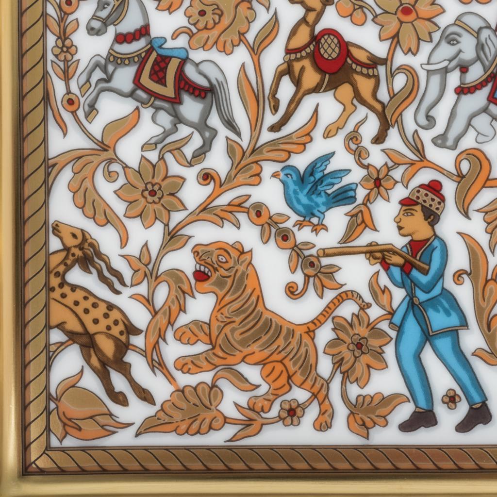 Guaranteed authentic Hermes porcelain Chasse En Inde ashtray / change tray.
Depicts a hunt in India intricately displayed in reds, gold and blue.
A perfect accent piece for any room.
Protected by velvet goatskin on the base.
Wonderful for desk or