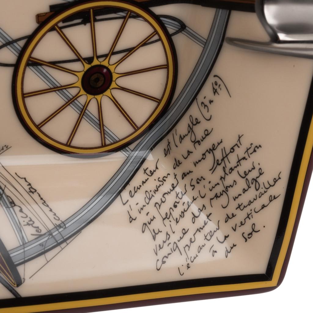 Guaranteed authentic Hermes rare Project de Voiture Petit-Duc Bateau porcelain change tray.
Printed Porcelain features the famed deconstructed summer carriage with equations, measurements, and 
notes swirling around the central motif. 
Designed by