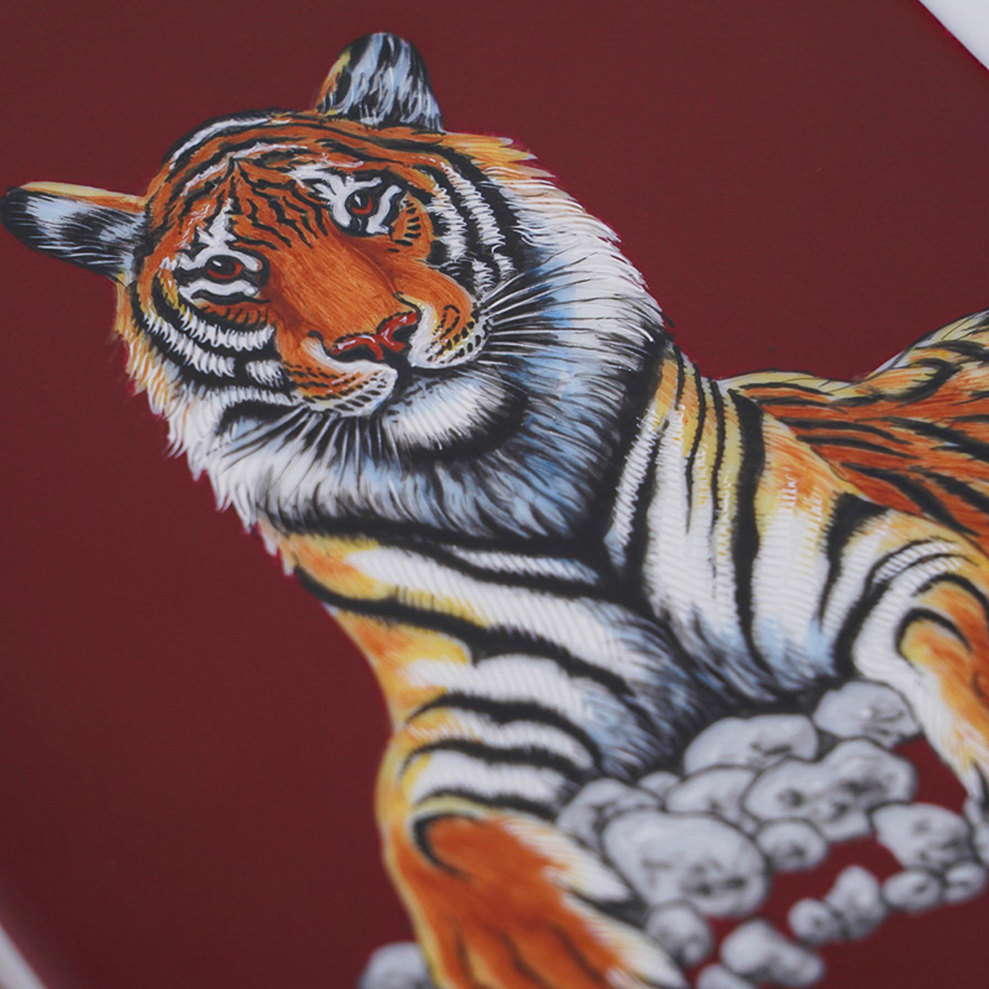 Mightychic offers a guaranteed authentic Hermes Tigre Royal featured in Gold (Or) and Red (Rouge) change tray.
Hand-painted Limoges Porcelain.
This magnificent regal tiger is a collectors treasure.
A decorative ashtray or tray piece perfect for any