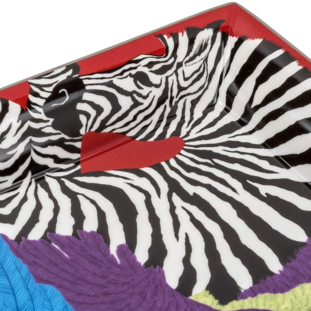 Mightychic offers an Hermes marvelous Zebra Pegasus Limoges porcelain change tray.
Bougainvillier colourway features beautifully detailed feathered wings to a gracefully rearing zebra. 
Designed by Alice Shirley.
A perfect accent piece for any