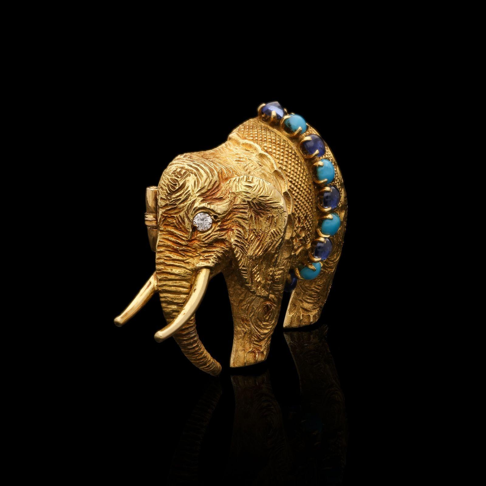 A charming gold elephant brooch by Hermès c.1960s, the three-dimensional brooch finely modelled in 18ct yellow gold as an elephant standing sideways and wearing a decorative blanket, all carefully textured to depict the elephant’s skin and woven