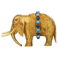 Charmante broche éléphant Hermès en or 18 carats et pierres précieuses, datant des années 1960