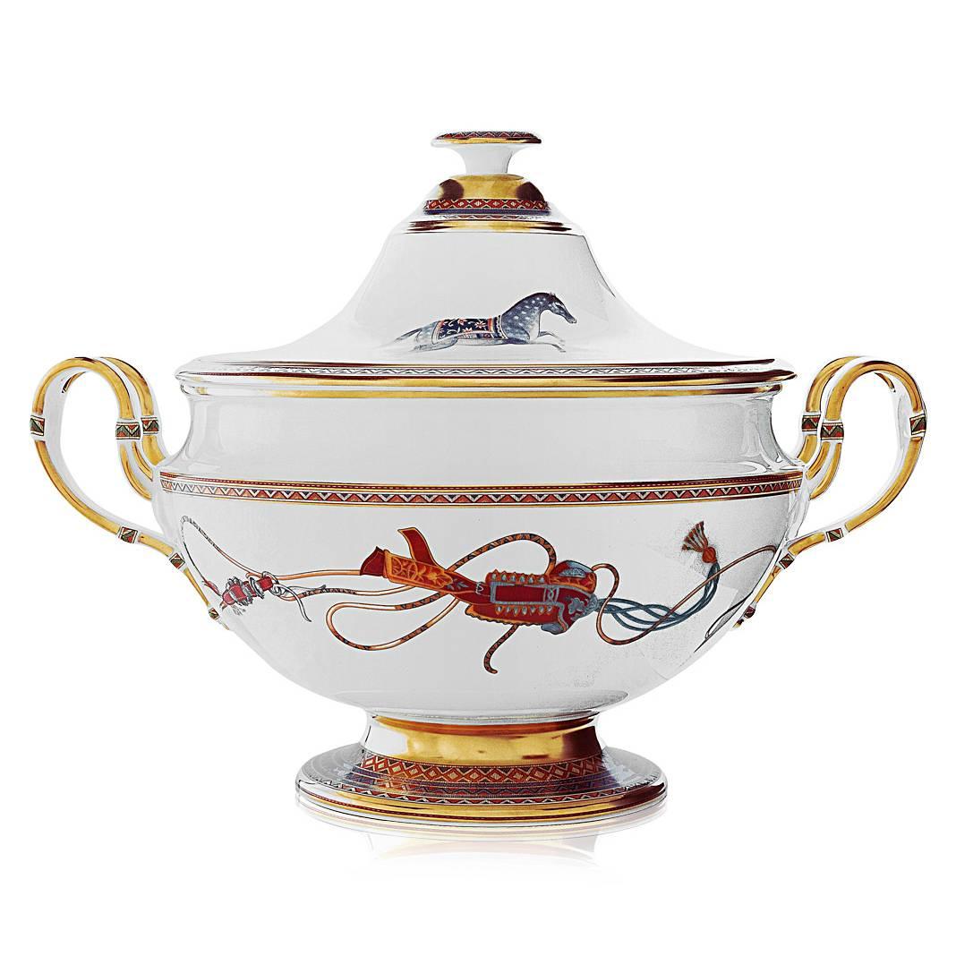 This magnificent Hermes Cheval d'Orient soup tureen has a pattern based on the intricacy and refinement of Persian miniatures, resplendent in colors and equestrian motifs richly evocative of Silk Road caravans. Made in Limoges, France. Cheval