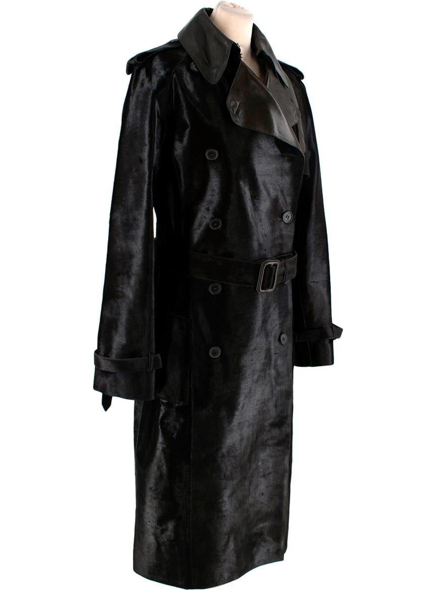 Hermes Chocolate Brown Calf Hair Trench Coat 
 

 -This stunning Hermes trench coat has a loose, double-breasted silhouette in smooth leather which give a unique contrast to the pony skin texture.
 -This trench coat comes with all the classic