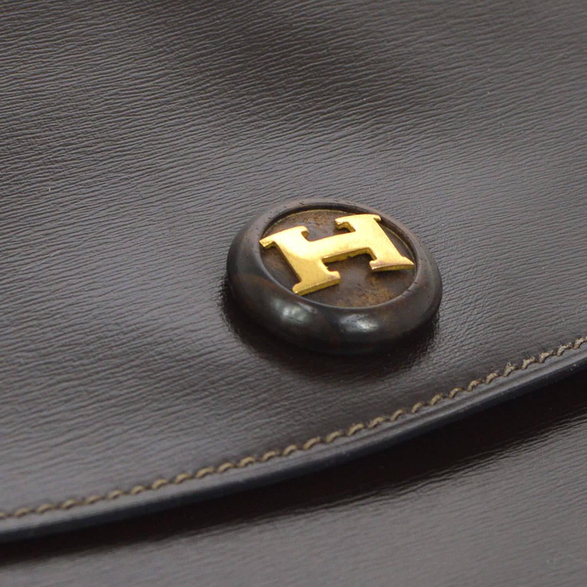 Hermes Chocolate Brown 'H' Charm Leather Evening Envelope Clutch Flap Bag

Leather
Gold tone hardware
Button closure
Date code present
Measures 9.5