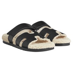 Hermes Chypre black shearling sandal