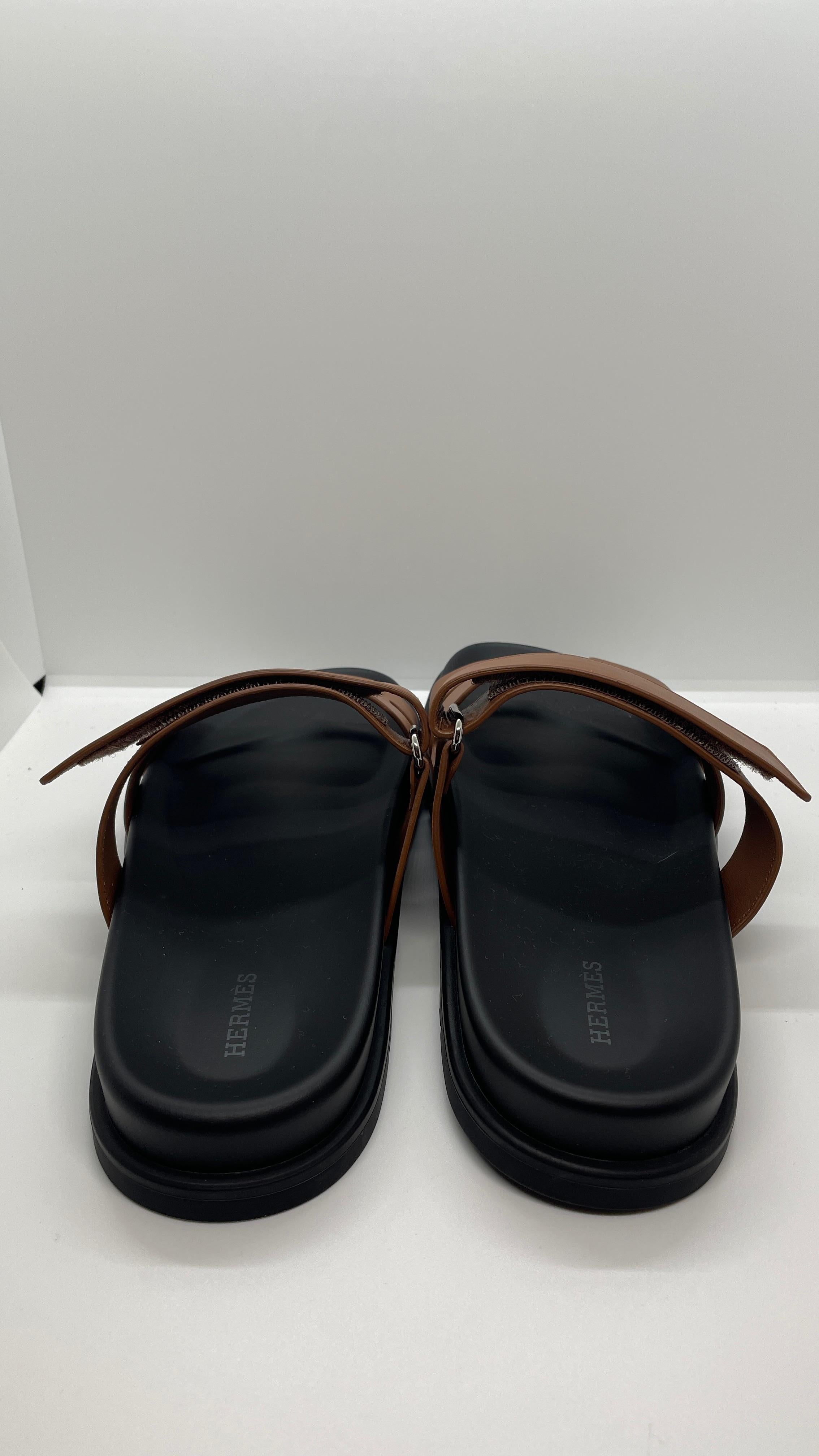 MOST WANTED SANDALS CHYPRE SANDALS  ( unisex) 

NEVER WORN ITEM 
SOLD OUT EVERYWHERE!!!  Size 44 available.

LEATHER BLACK WITH GOLD 

PERFECT FOR STREET OR BEACH OUTWEAR 

INCLUDES; SHOPPING BAG / RIBBON / DUST BAG/ COPY ORIGINAL INVOICE 
