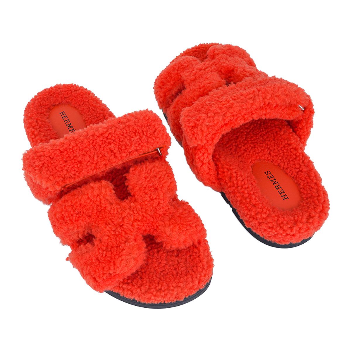 Mightychic offers a pair of limited edition Hermes Chypre Sandals featured in Orange Shearling.
Techno-sandal with anatomical rubber sole for heavenly comfort in insulating woolskin shearling.
Strap across foot is adjustable with velcro
