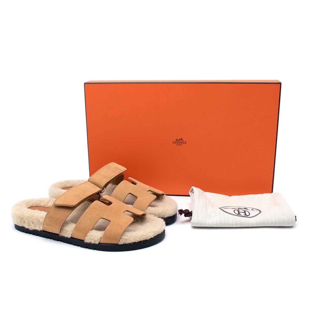 Hermes Chypre Tan Suede Sandals - Sold Out/Rare

- Adjustable velcro strap
- Soft ecru wool skin insole
- Golden beige goatskin lining
- Black rubber sole

Materials:
Rubber sole
Woolskin insole
Goatskin lining 

Made in Italy

PLEASE NOTE, THESE