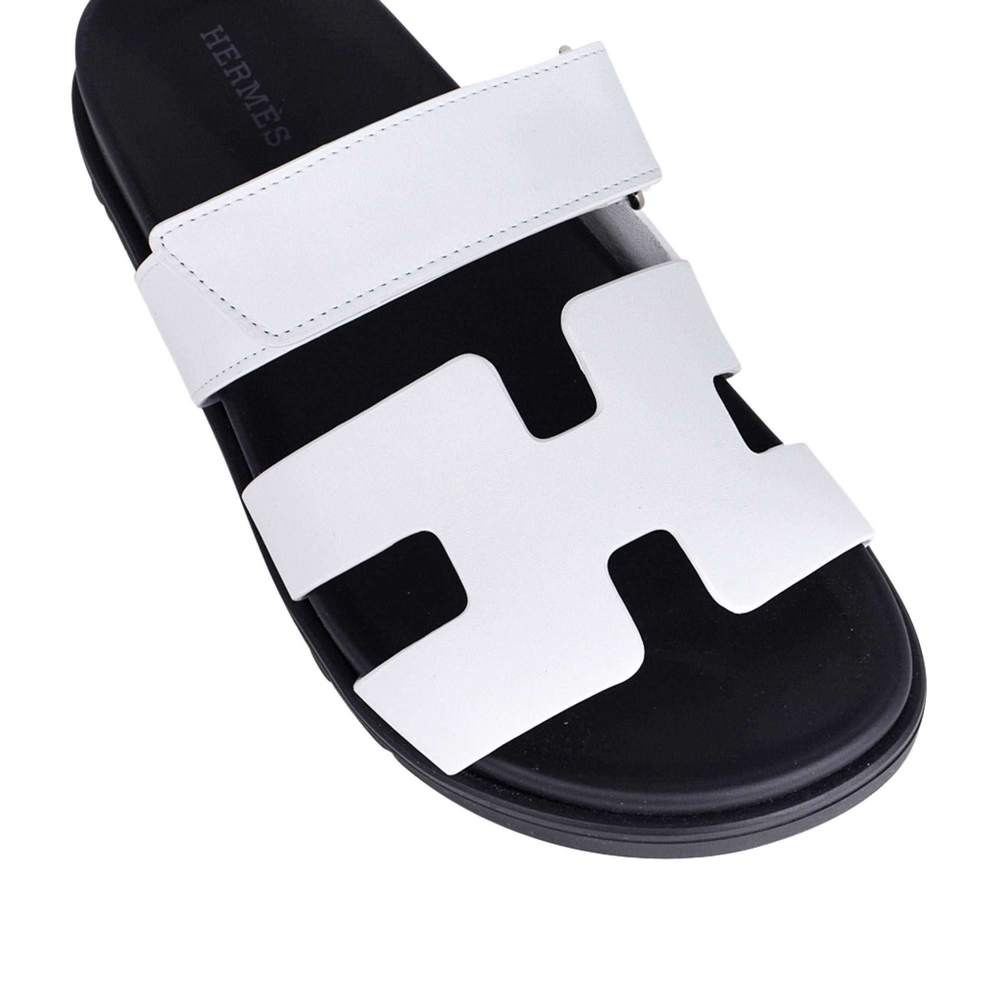 Mightychic offers a limited edition Hermes Chypre Sandal featured in White.
Calfskin with black anatomical insole and H embossed Black rubber sole.
Strap across foot is adjustable with velcro closure.
Comes with sleepers and and signature Hermes