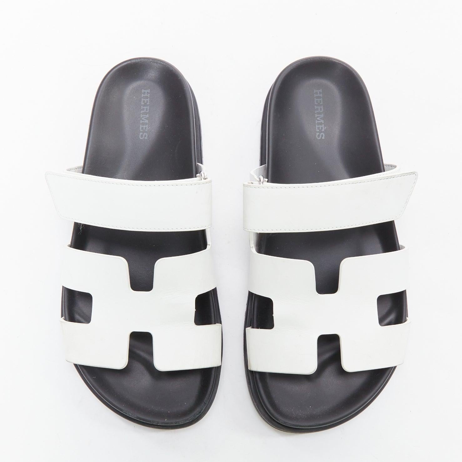 HERMES Chypre white leather H black techno sandals EU37
Reference: KYCG/A00111
Brand: Hermes
Model: Chypre
Material: Leather
Color: White, Black
Pattern: Solid
Closure: Magic Tape
Lining: Black Leather
Extra Details: Techno-sandal in calfskin with