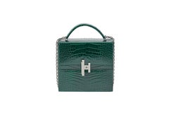 Hermès Cinhetic in Vert Fonce Verso Alligator Leather with Palladium hardware.