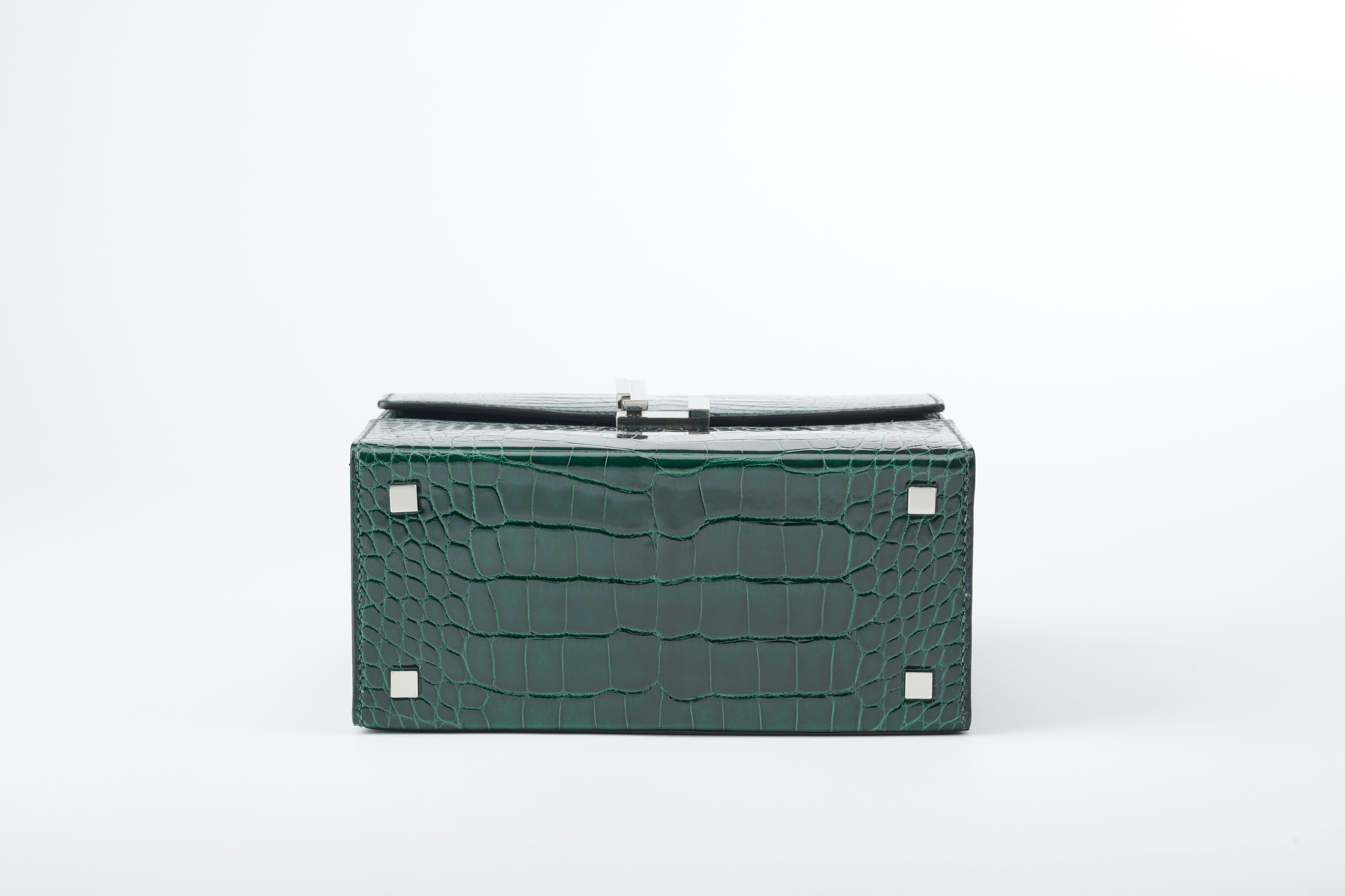 Black Hermès Cinhetic in Vert Fonce Verso Alligator Leather with Palladium hardware.