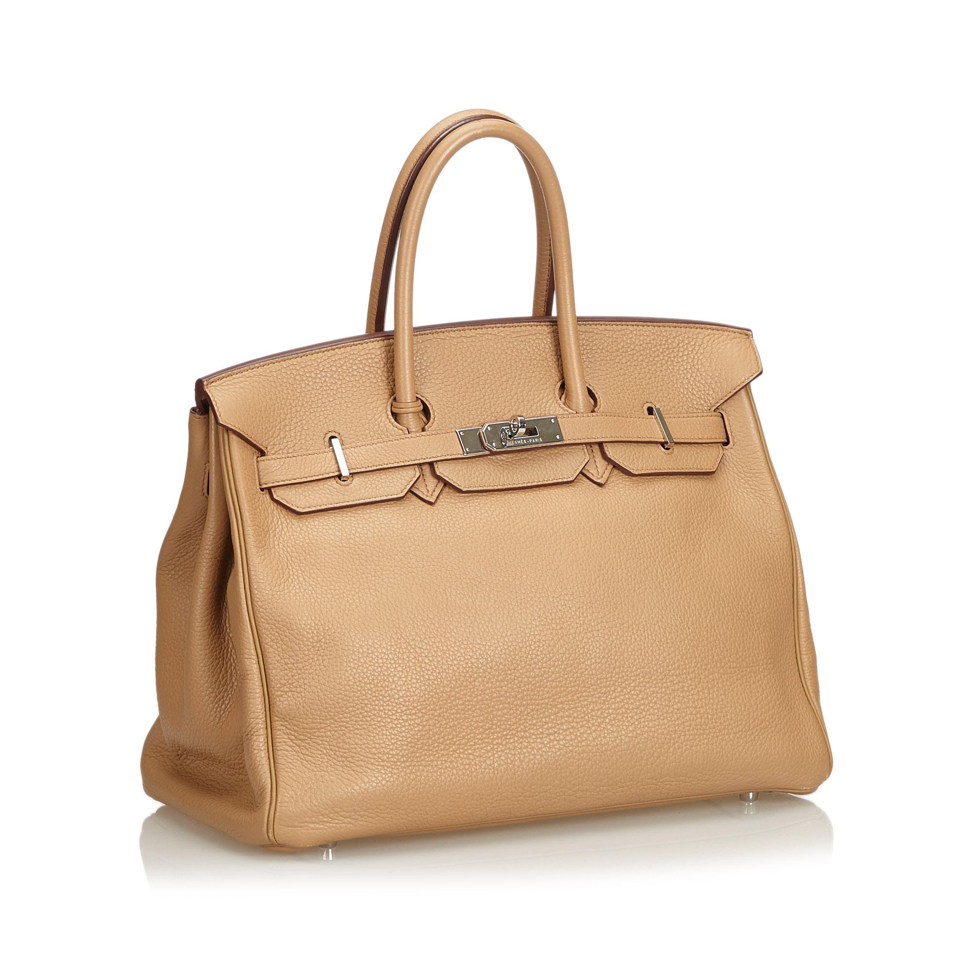 Hermes Clemence Birkin 35

The Birkin 35 features a Clemence leather body, rolled leather handles, front flap with turn-lock closure, gold hardware, leather lining, and interior open and zip pockets. It comes with a clochette, lock, and key.

Please
