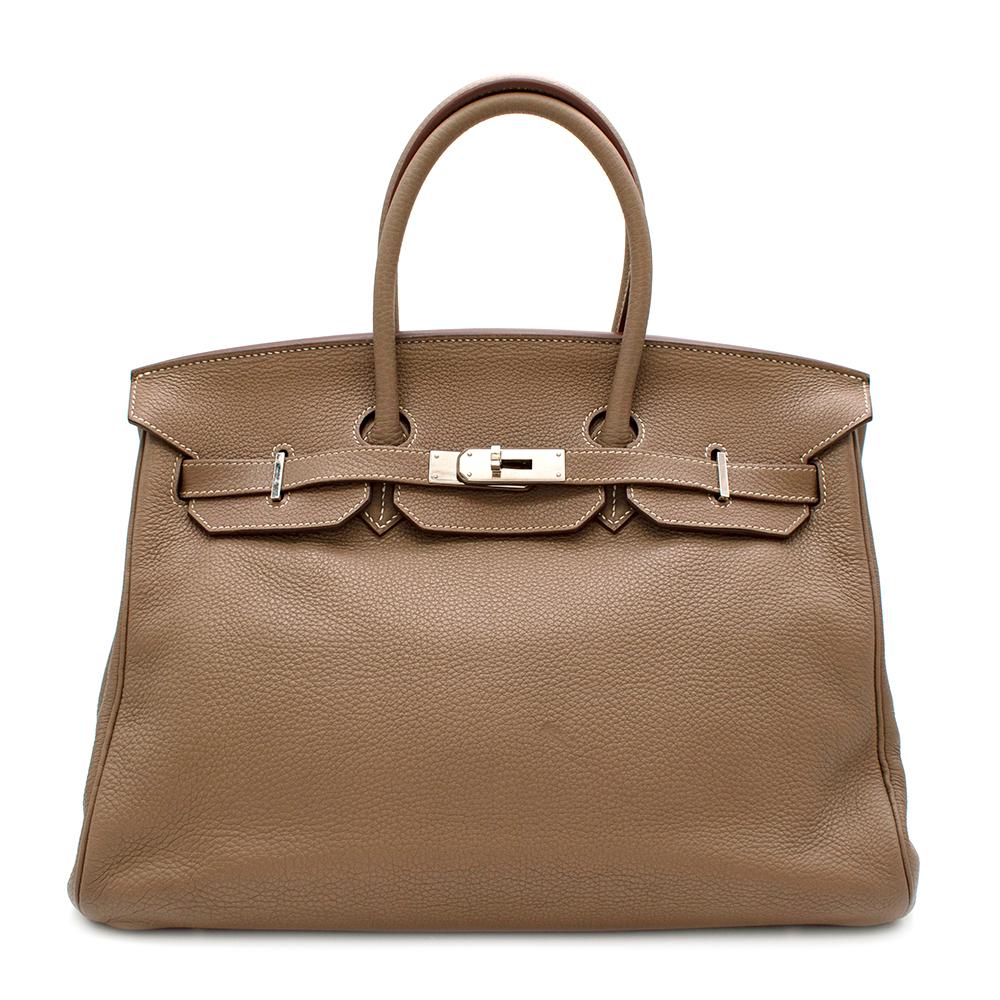 Hermes Clemence Leather Etoupe Birkin 35 PHW

- Age [o] 2011
- Rolled Top Handles 
- Twist-lock closure on front flap
- Inside zip compartment
- Palladium hardware
- Clochette with padlock and keys
- Dust bag, raincoat and box included

Material
-