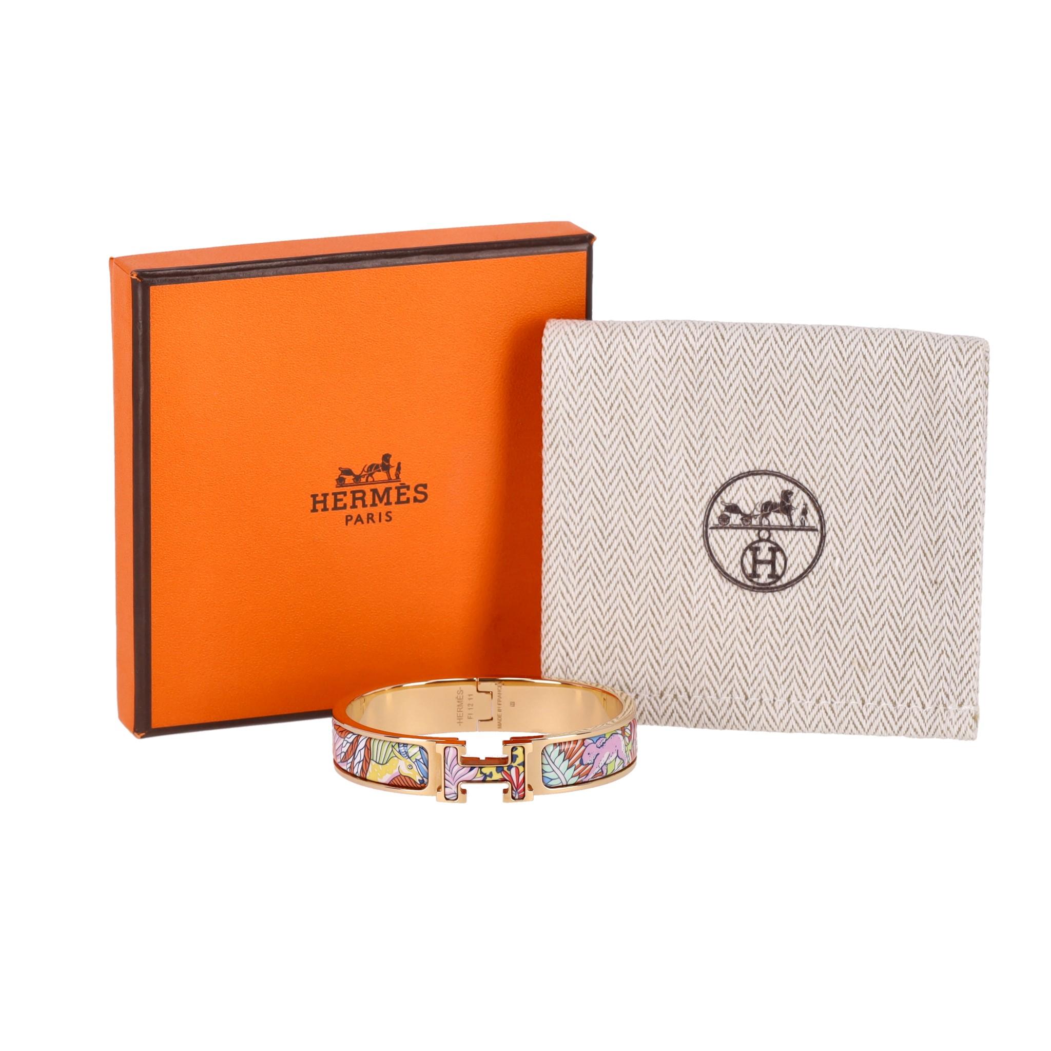 Hermes Clic Clac H 18k Gold Plated Animaux Camoufles Bracelet

From Clic H collection is this 18k gold plated brass bracelet with multicoloured 