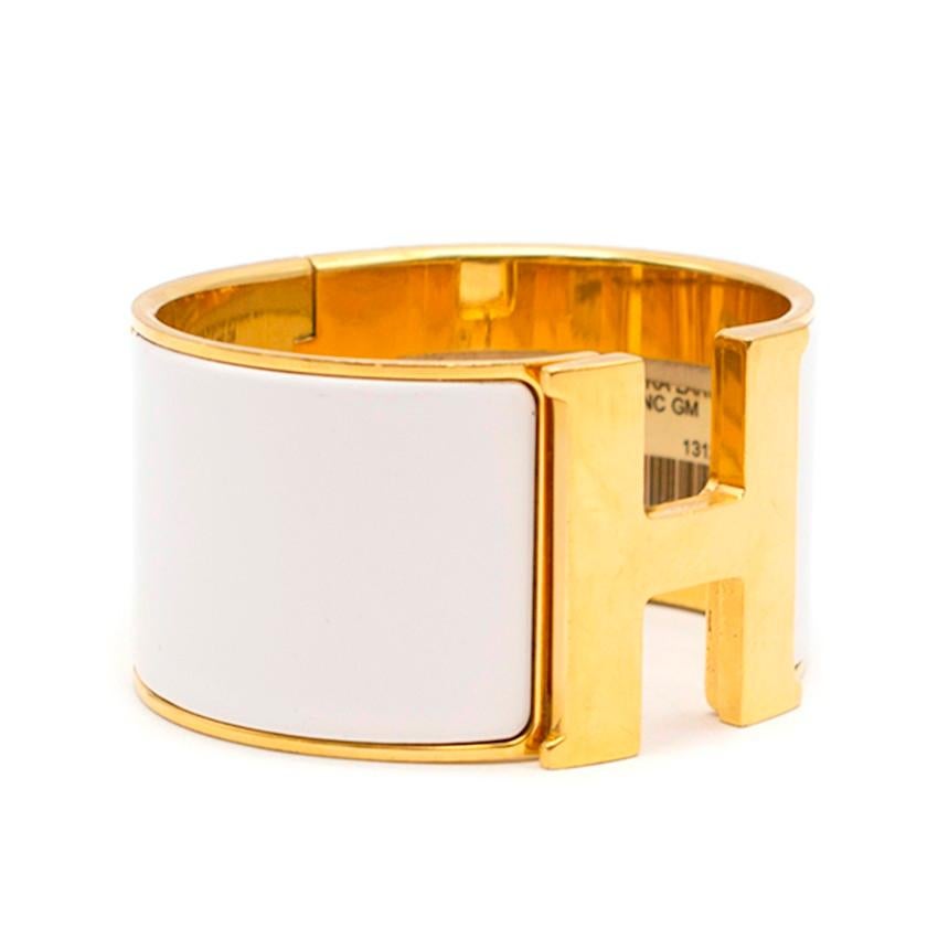 Hermes Clic Clac H Extra Large vintage enamel bangle

- Serial Number: P - 2012
- Yellow-gold plated brass
- Thick bangle, white enamel coating 
- H twist-lock fastening, hinged base

Please note, these items are pre-owned and may show some signs of