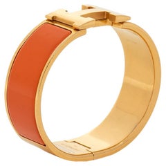Hermès Clic Clac H Orange Enamel Gold Plated Wide Bracelet PM