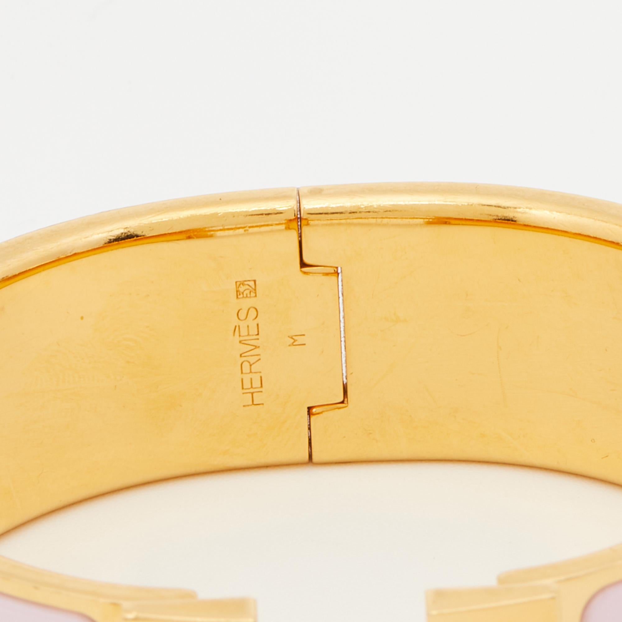 Let your jewelry speak for you with this Hermes Clic Clac H bracelet. It’s just perfect for those beach summer days! This bracelet is made with gold-plated metal, and the cherry on top is the signature Hermes ‘H’ logo on the front. It will