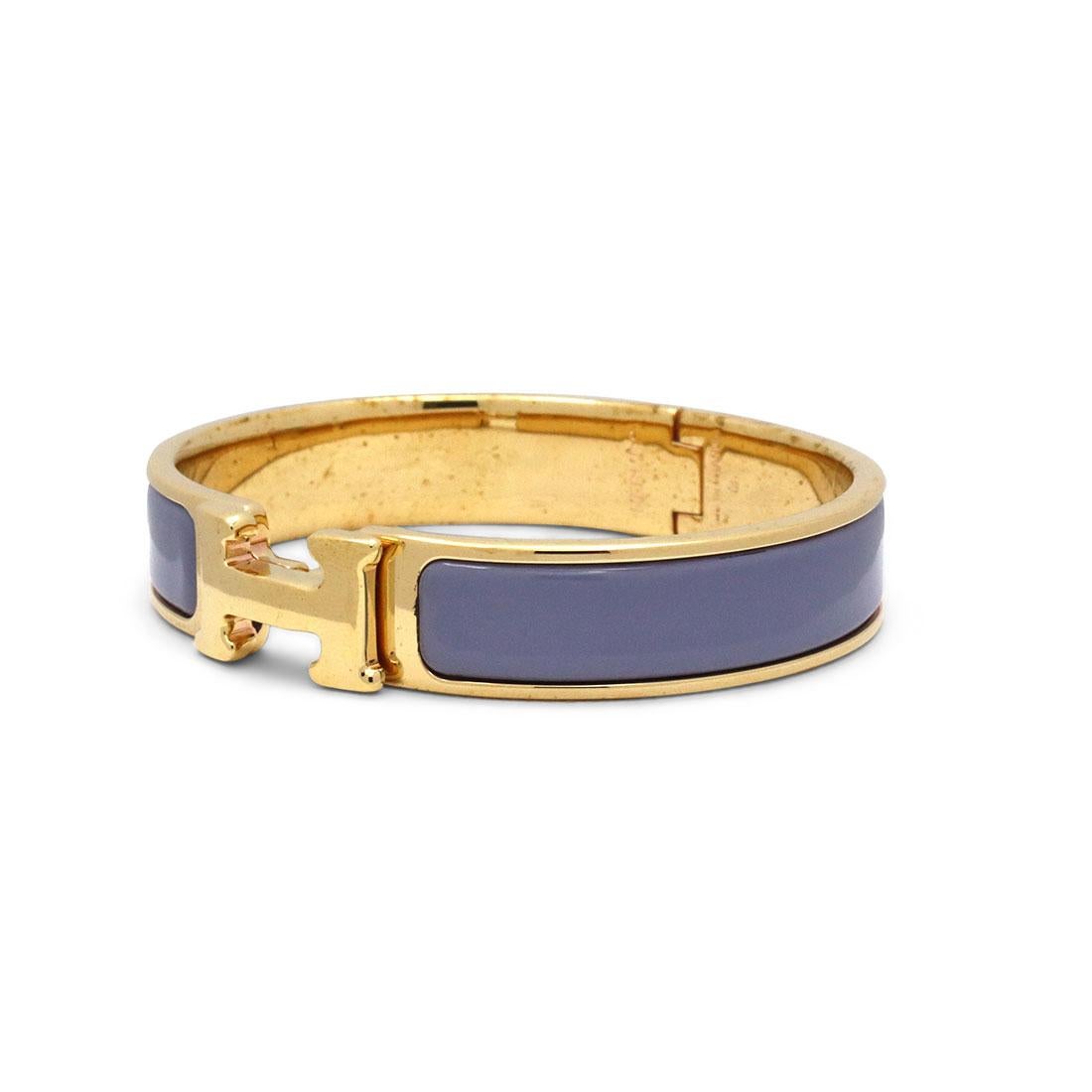 Authentic Hermes Clic H bangle crafted in gold plated hardware enclosed around parme colored enamel. This classic bangle features Hermes signature 'H' stamp on the bangle as the closure and fits up to a 5 1/2 inch wrist. Signed Hermès, Made in
