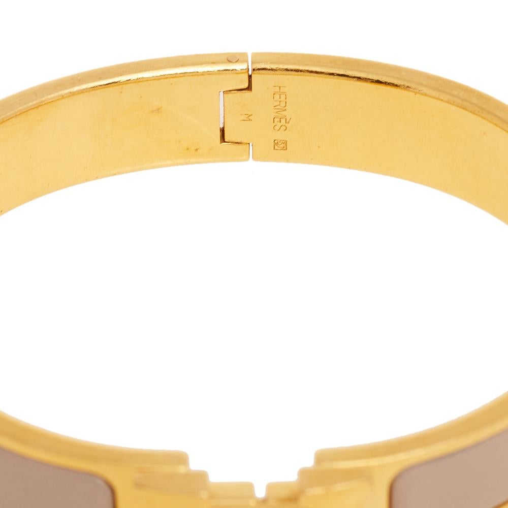 This bracelet embodies Hermès’ elegant craftsmanship with its gold-plated metal body and enamel inlay. Featuring the iconic H logo of the fashion house at the front, this bracelet is the accessory to buy today!

Includes: Original Box, Original