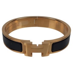 Bracelet Clic H d'Hermès en émail noir et finition plaqué or, taille GM 19 cm 