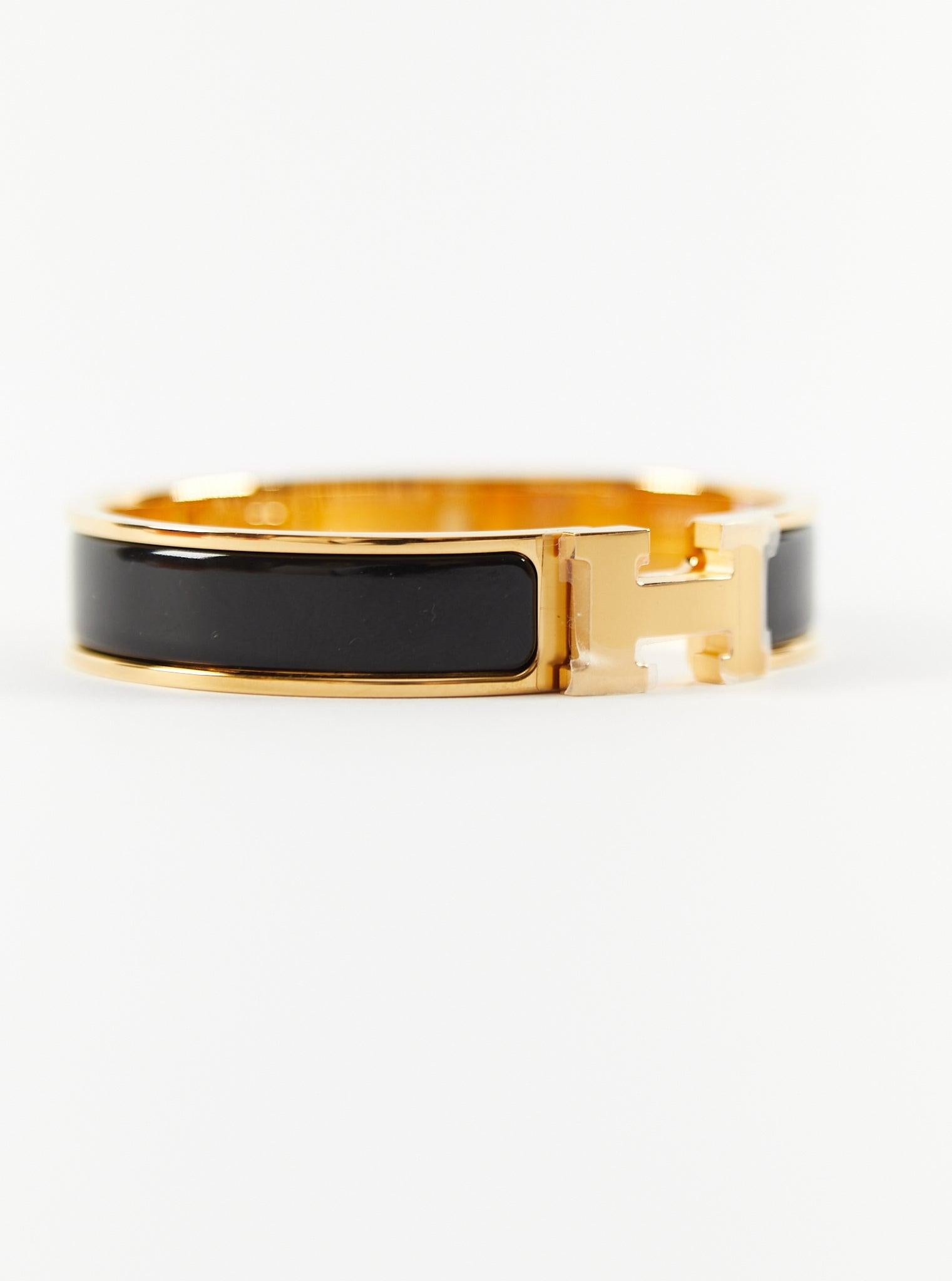 Bracelet Clic H PM d'Hermès en noir et or

Taille du poignet : 16.8 cm  Largeur : 12 mm

Fabriqué en France