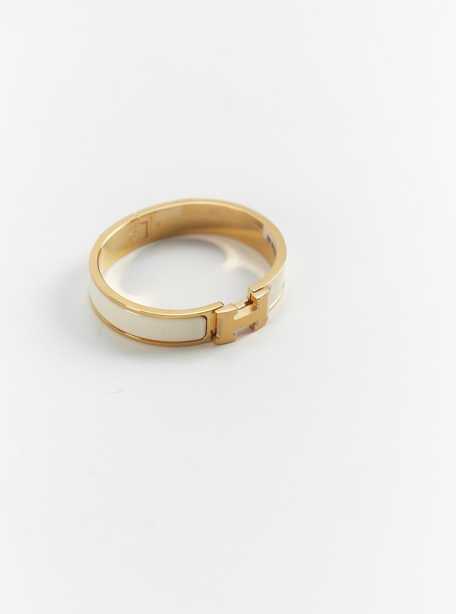 Hermès Clic H PM-Armband in Creme und Gold

Größe des Handgelenks: 16.8 cm  Breite: 12 mm

Hergestellt in Frankreich