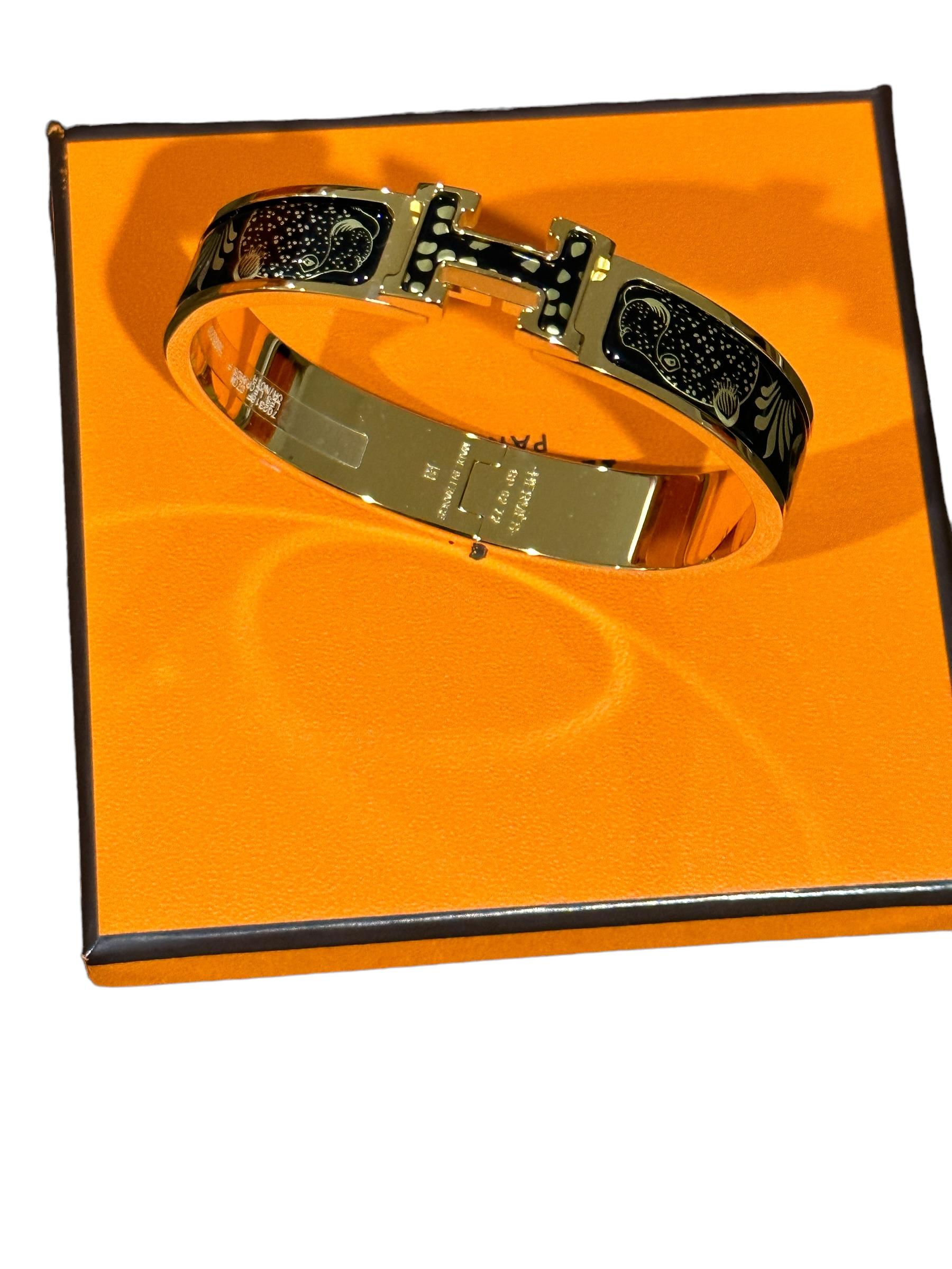 Hermes Printed Enamel Bracelet
Plastic on Hardware from store
Les Leopards
Black and Gold is there anything better?
Enamel
Yellow Gold Plated 
Size PM
Circumference: 7