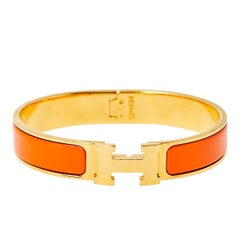 Hermès Clic H Orange Enamel Gold Plated Narrow Bracelet PM