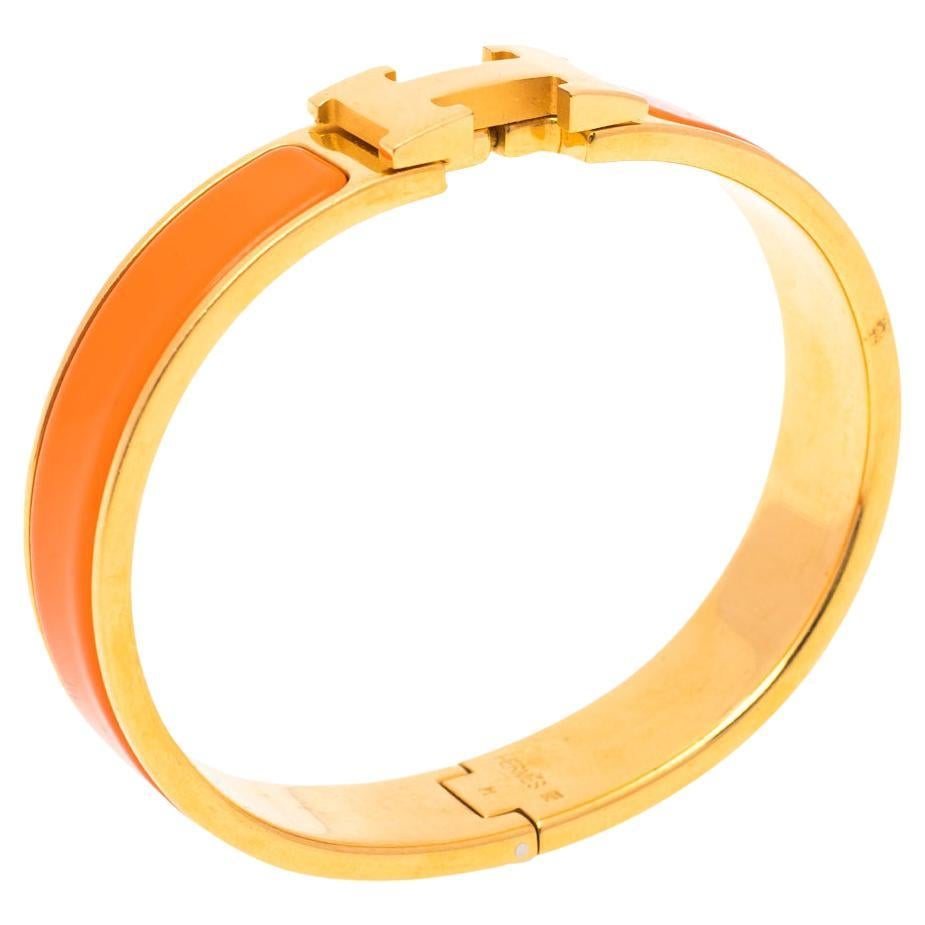 Hermès Clic H Orange Enamel Gold Plated Narrow Bracelet PM