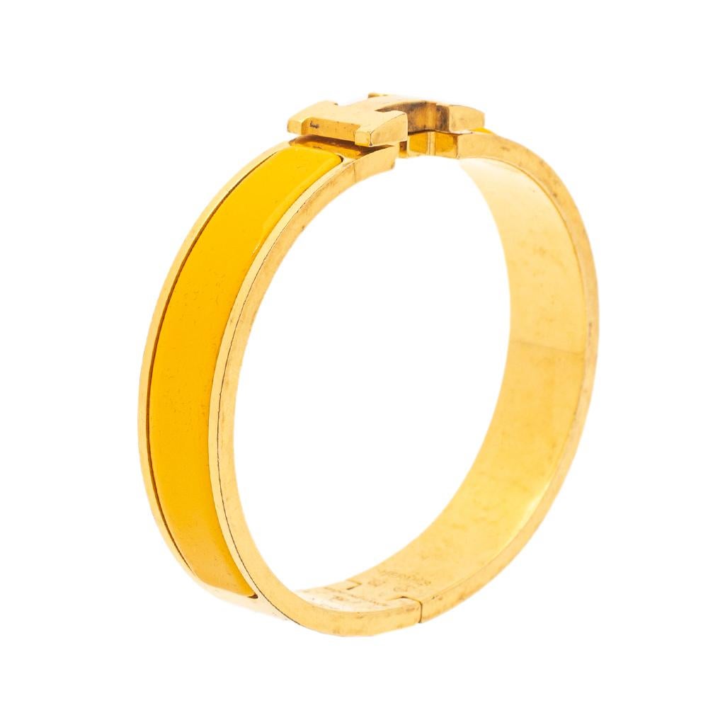This bracelet embodies Hermès’ elegant craftsmanship with its gold-plated metal body and yellow enamel inlay. Featuring the iconic H logo of the fashion house at the front, this bracelet is the accessory to buy today!

Includes: Original Dustbag

