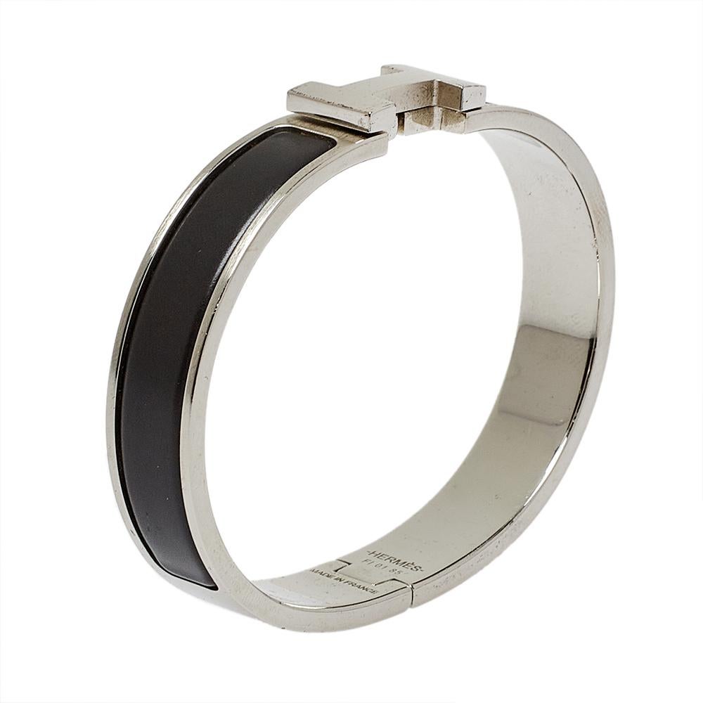 This bracelet embodies Hermès’ elegant craftsmanship with its palladium-plated metal body and black enamel inlay. Featuring the iconic H logo of the fashion house at the front, this bracelet is the accessory to buy today!

Includes: Brand Box,