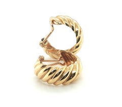 Orecchini a cerchio con chiusura a clip Hermès, in oro giallo 18 carati con motivo a spirale, vintage