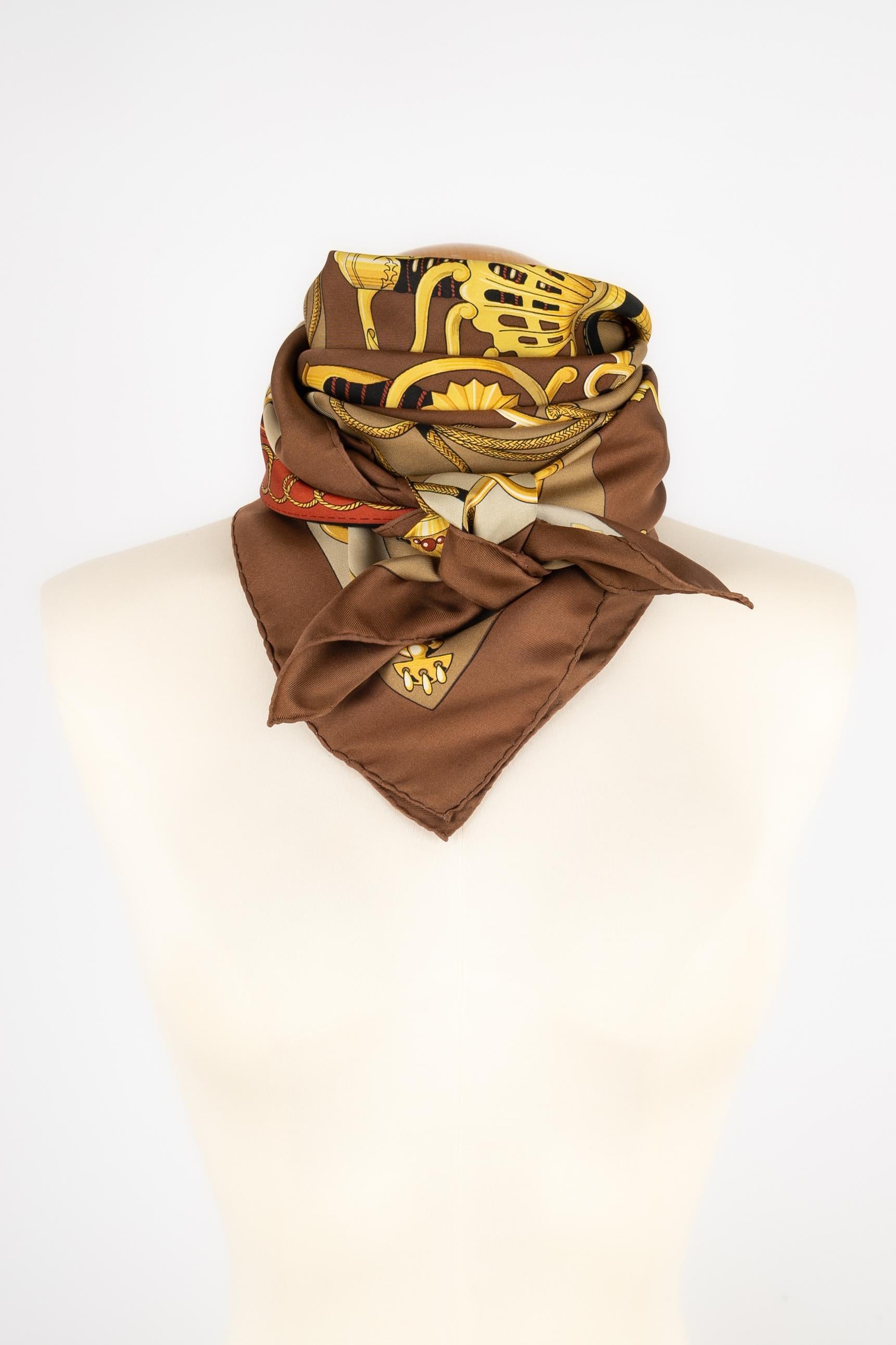 HERMÈS - (Made in France) Silk twill squared foulard illustrated with the 'Cliquetis' theme designed by Julie Abadie. Produced in 1972, reproduced in 1986, 2010, 2011, and 2018.

Condition:
Very good condition

Dimensions:
90 cm x 90 cm

FFH19