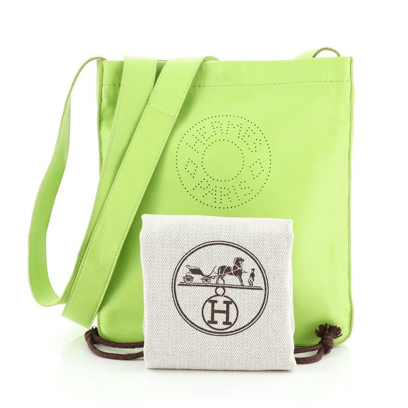 This Hermes Clou De Selle Bag Lambskin, crafted in Kiwi green Milo lambskin, features a long leather shoulder strap, Clou de Selle stamping, and palladium-tone hardware. It opens to a Kiwi green Milo lambskin interior. Date stamp reads: O Square