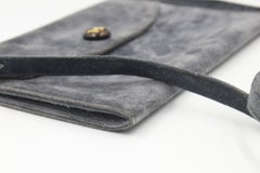 Hermès clutch in grey suede leather, with removable shoulder strap.