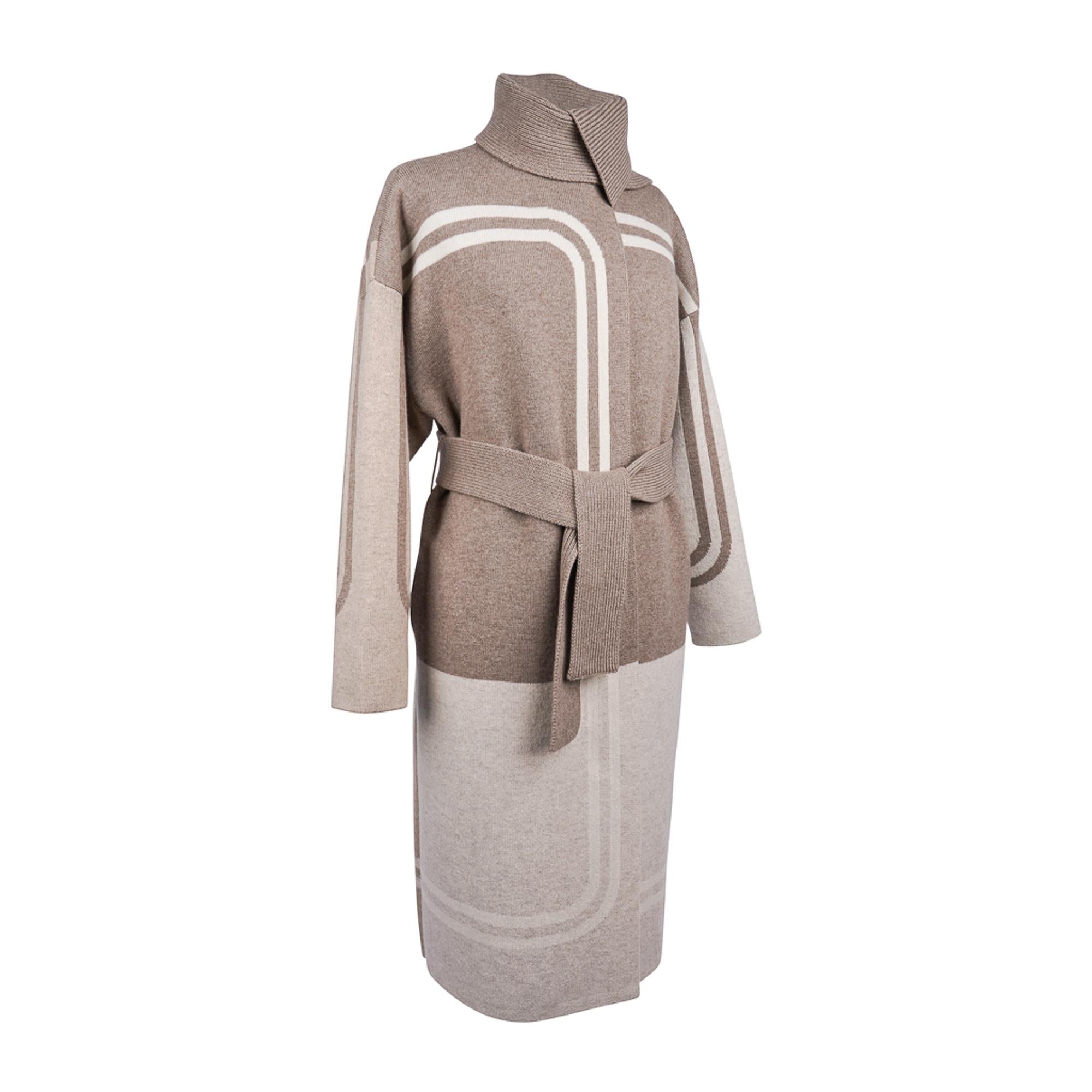 Mightychic offers an Hermes Long Coat depicting the iconic Brides de Gala design by Hugo Gyrgkar.
Expressed in Beige Lin Intarsia.
The coat is belted with a scarf collar and drop shoulder.
2 side pockets.
Simply stunning!
Fabric is Scottish