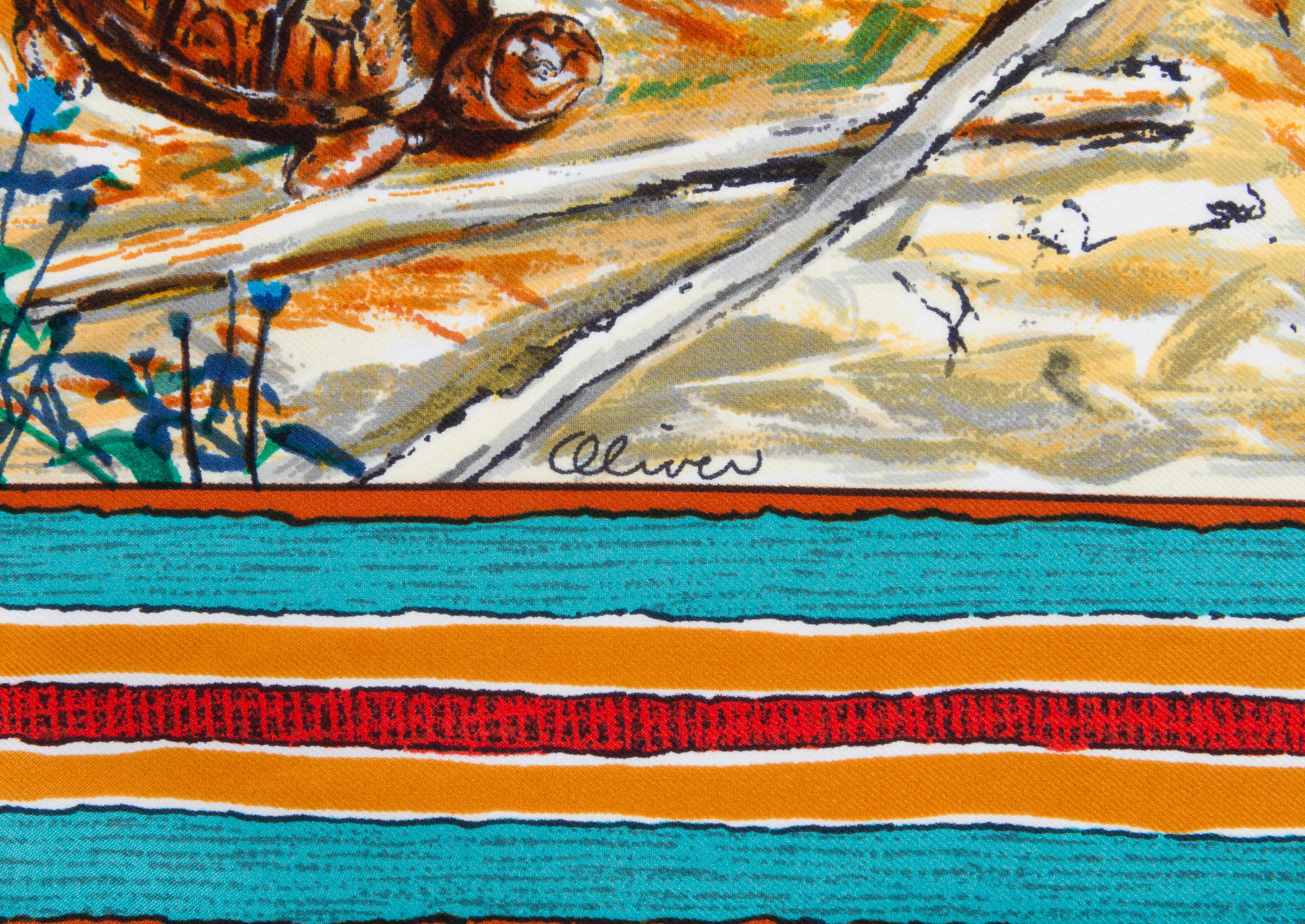 Foulard Les Cheyennes en twill de soie Hermès, conçu par Kermit Oliver, avec bordure bleue. Etat neuf, étiquette d'entretien attachée. Bords roulés à la main. 

