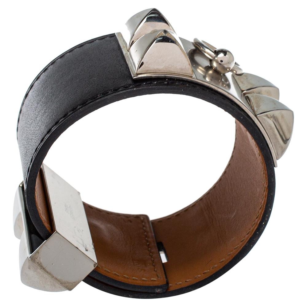 Exuding a downtown, punk vibe, this instantly recognizable bracelet is from the signature Collier de Chien collection of Hermès. The bracelet, made of black leather, is adorned with the iconic Collier de Chien motif in palladium plated metal